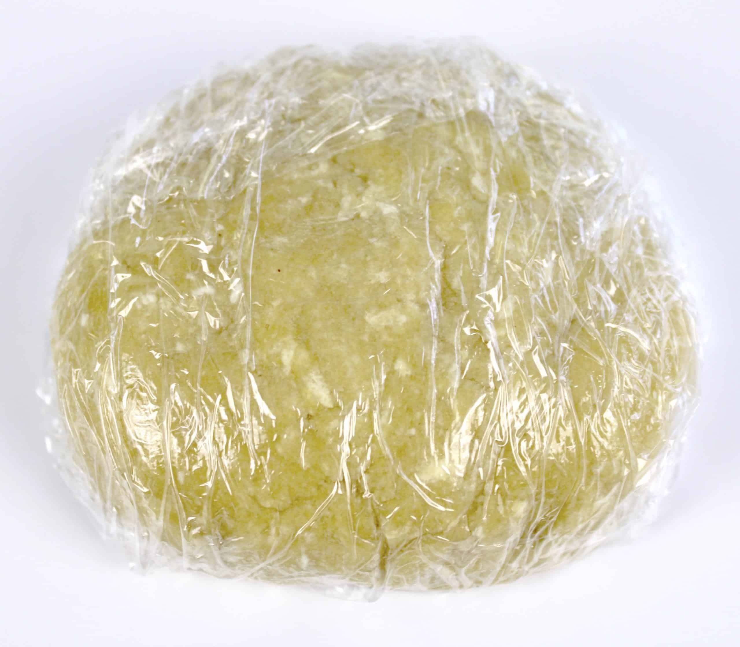 pie crust dough wrapped in plastic wrap