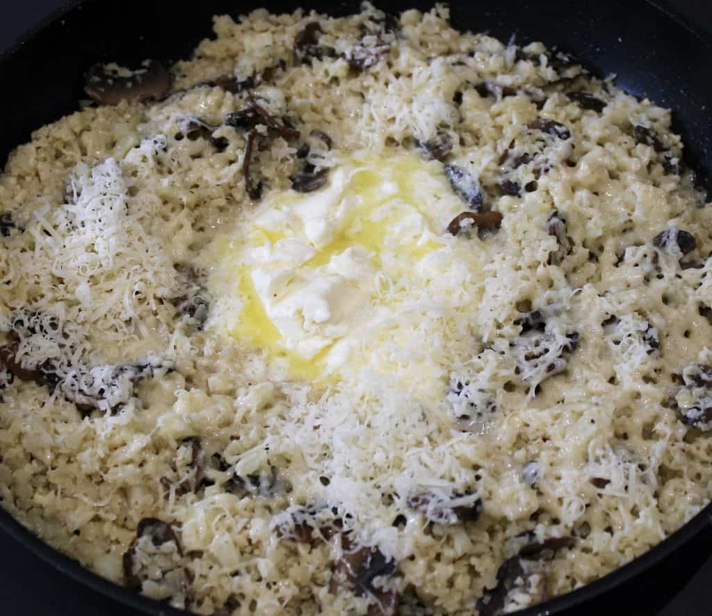 cauliflower mushroom risotto in skillet with mascarpone in the middle