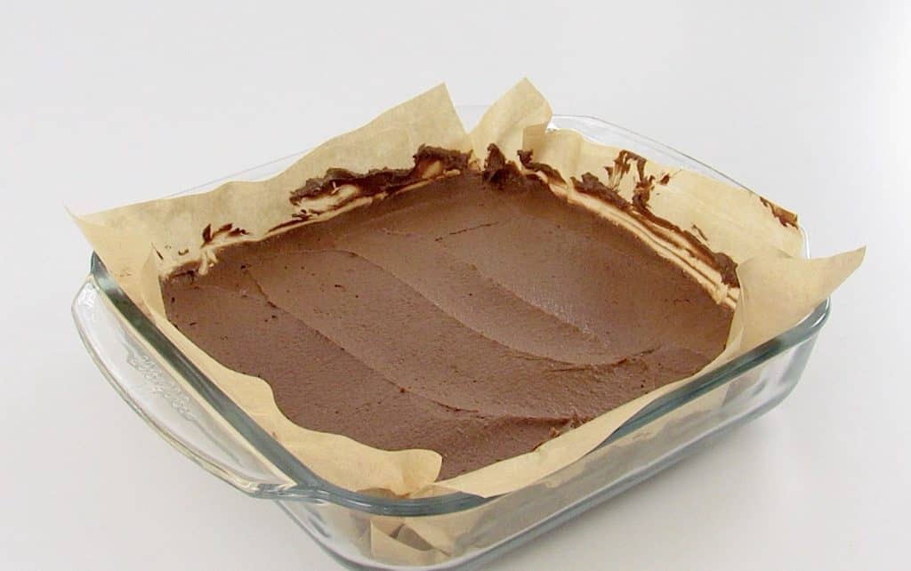 chocolate avocado brownie batter in glass baking dish