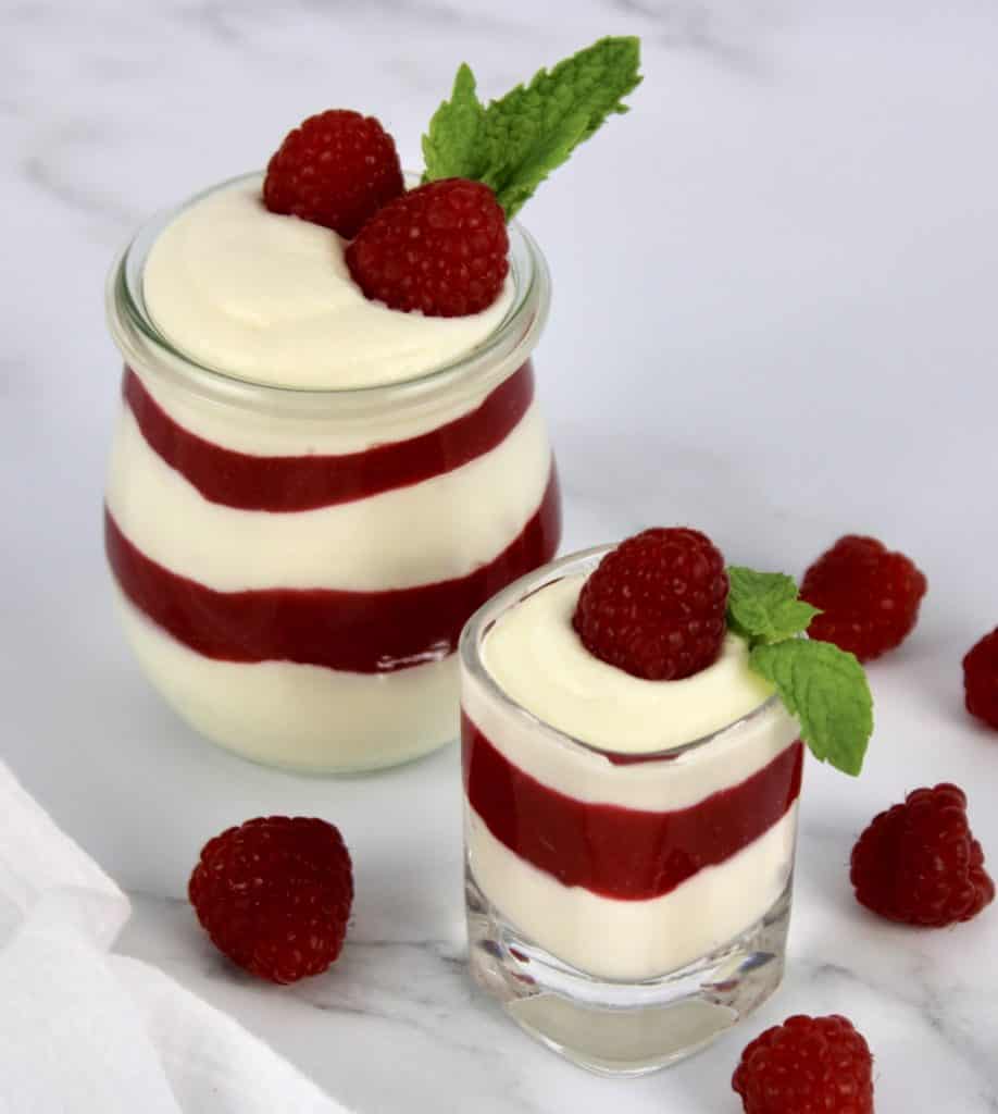Keto Raspberry White Chocolate Mousse in glass and in shot glass layered