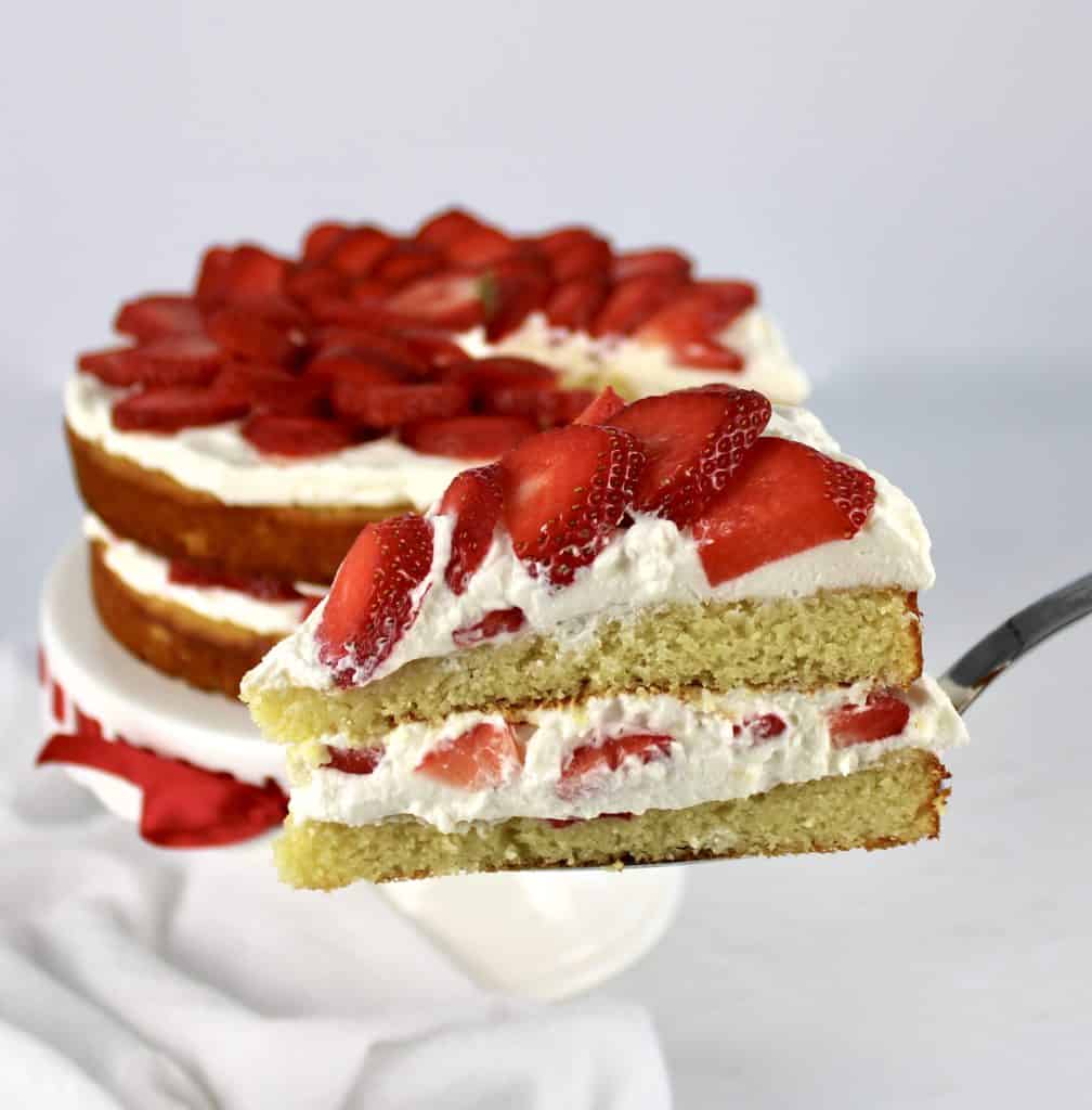 strawberry shortcake with slice being held up