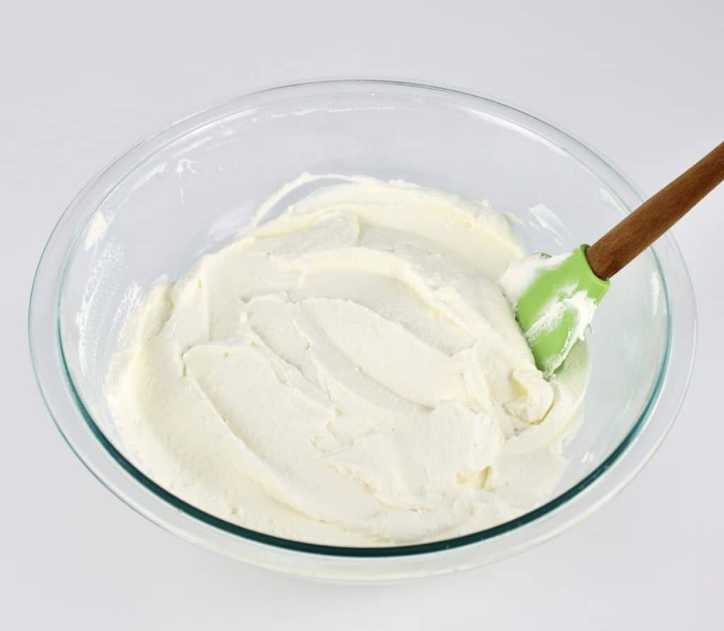 shortcake whipped topping in glass bowl with spatula