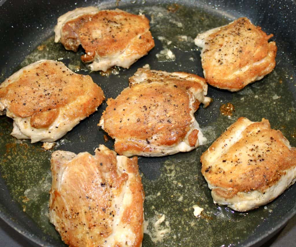 6 fried chicken thighs in skillet