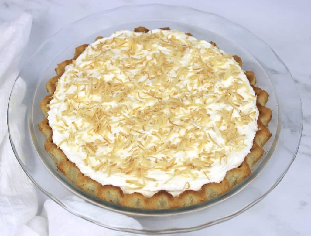coconut cream pie in glass pie dish
