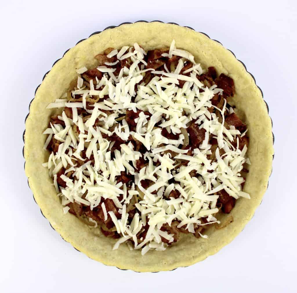 bacon and shredded cheese in tart crust