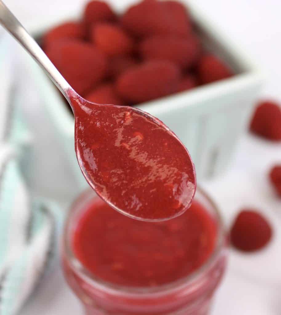 closeup of raspberry jam in spoon