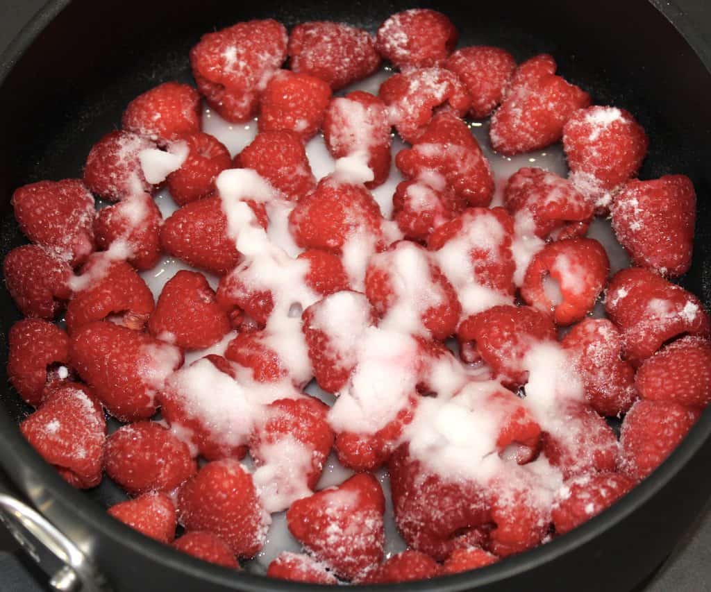 raspberries lemon and sweetener in saucepan