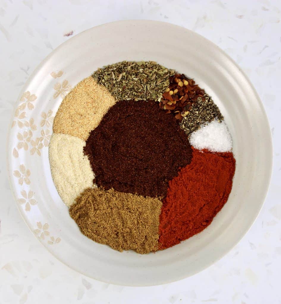 taco seasoning ingredients on beige plate