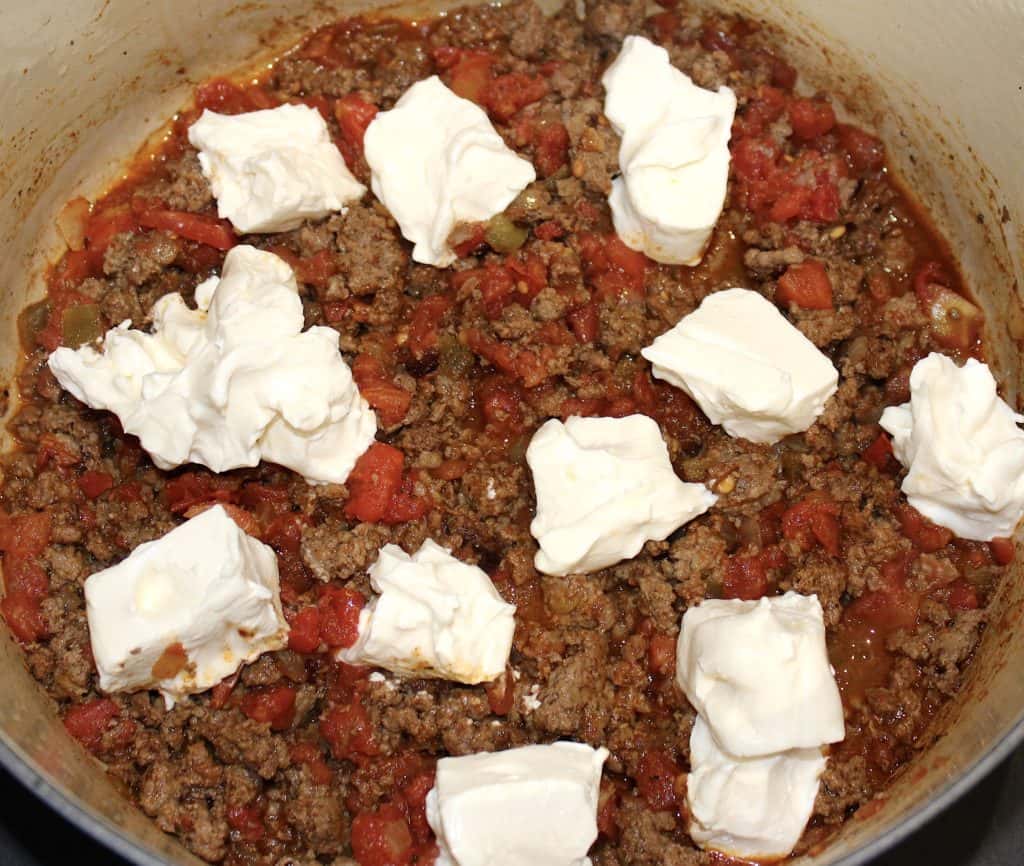 taco soup base with dollops of cream cheese