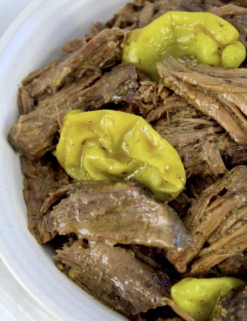 mississippi pot roast with peppers in white bowl