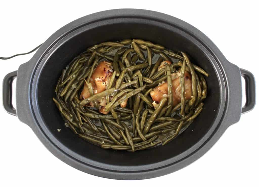 cooked green beans and ham hocks in crockpot