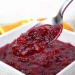 cranberry sauce in white bowl with spoonful