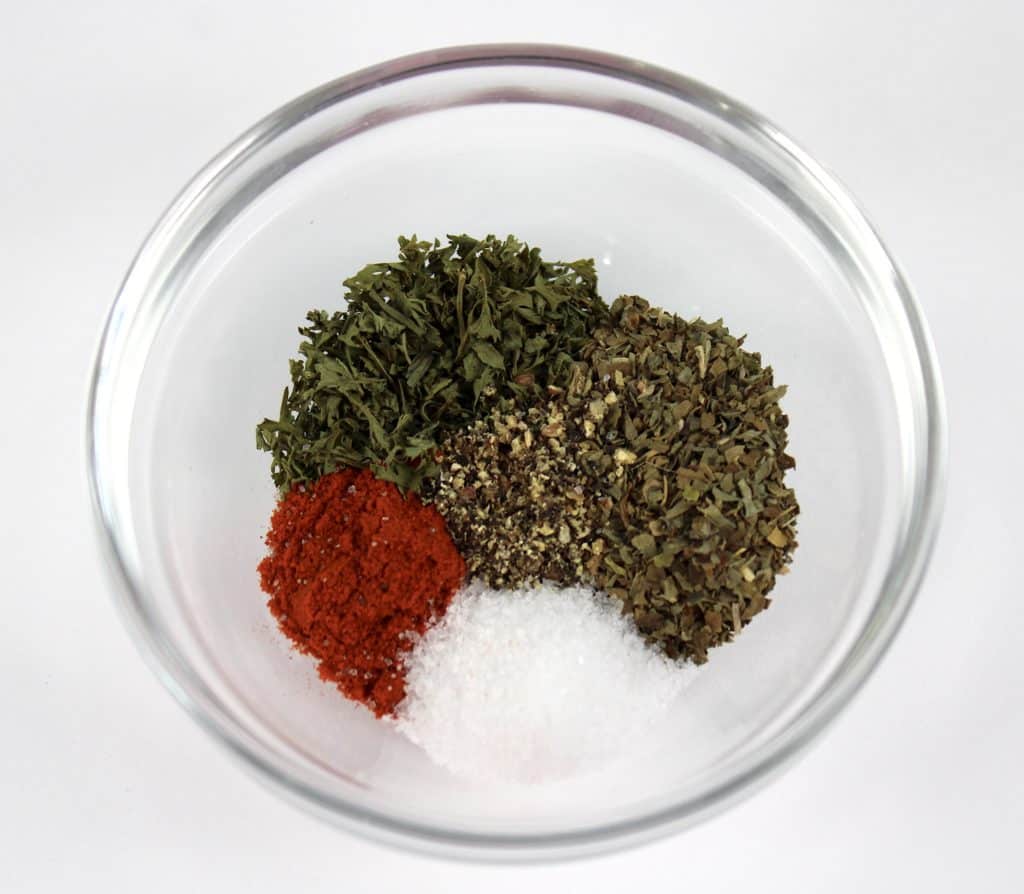 5 different spices in glass bowl unmixed