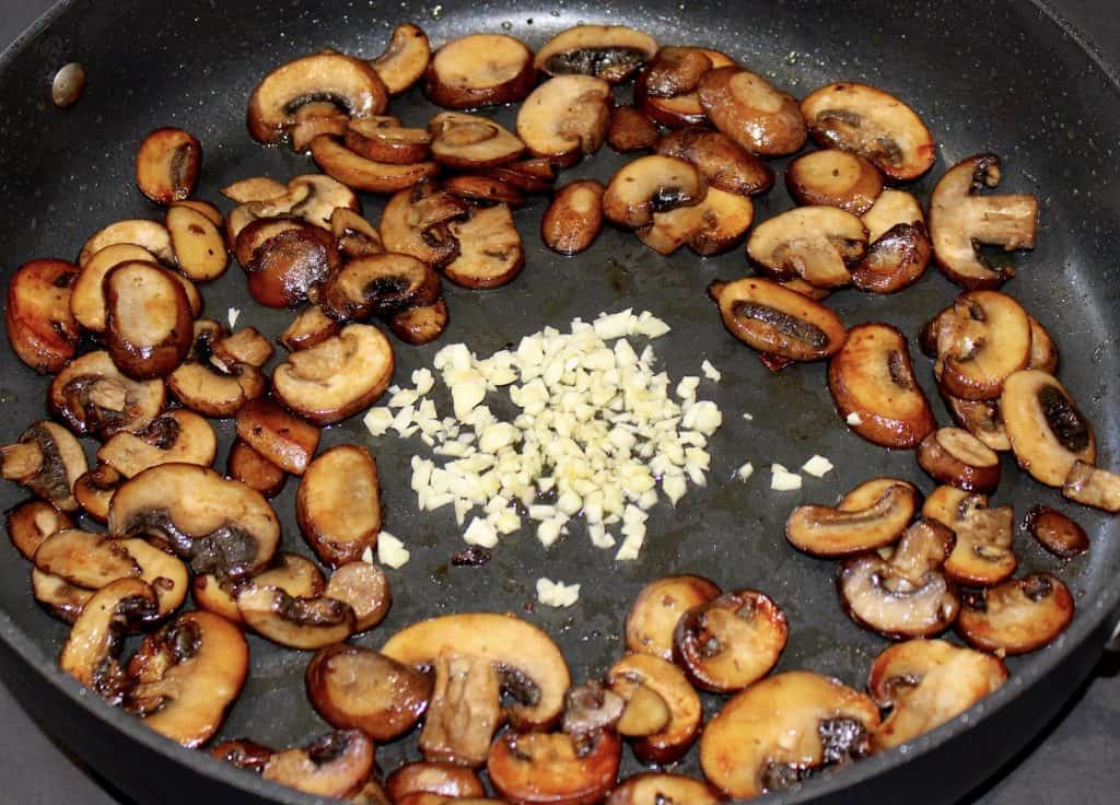 cooked mushrooms and garlic in skillet