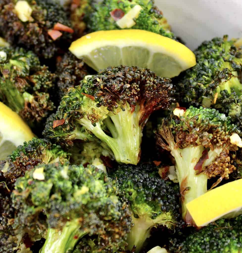 closeup of Air Fryer Broccoli with lemon slices