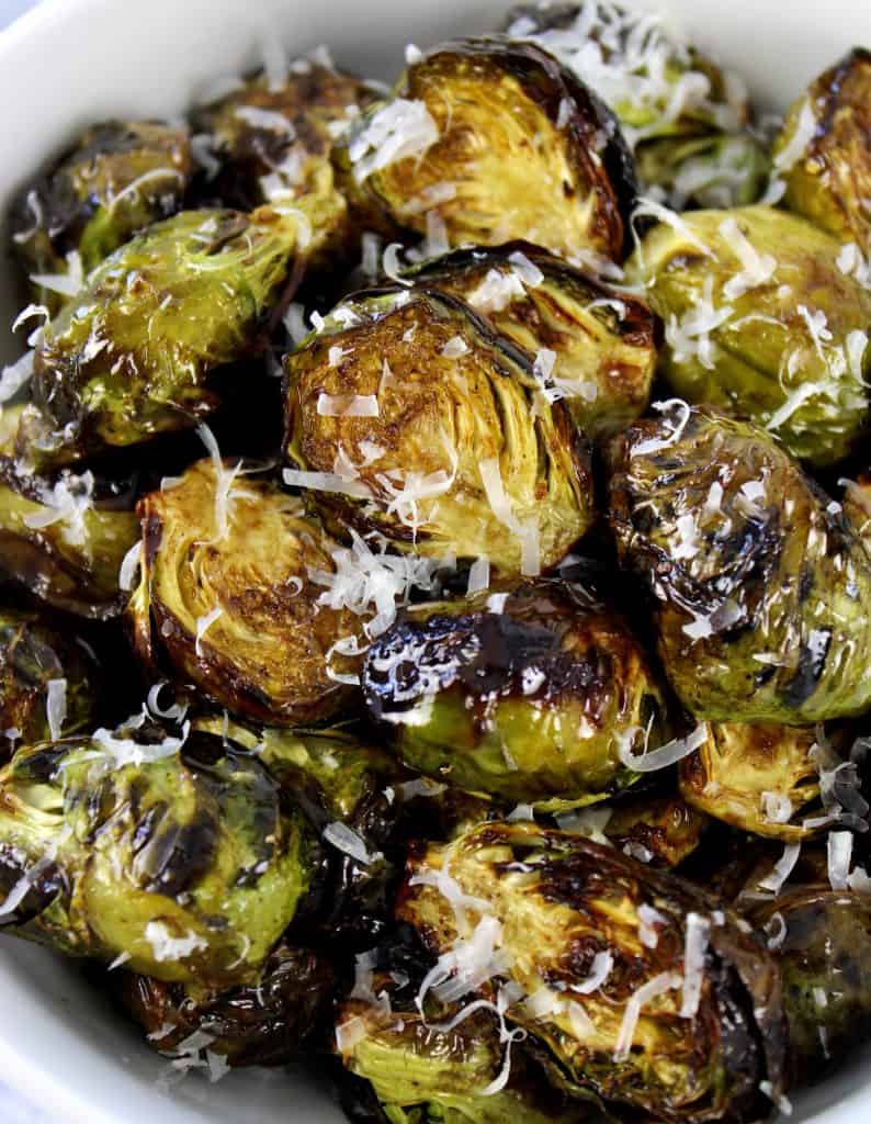 closeup of Air Fryer Brussels Sprouts with grated cheese on top