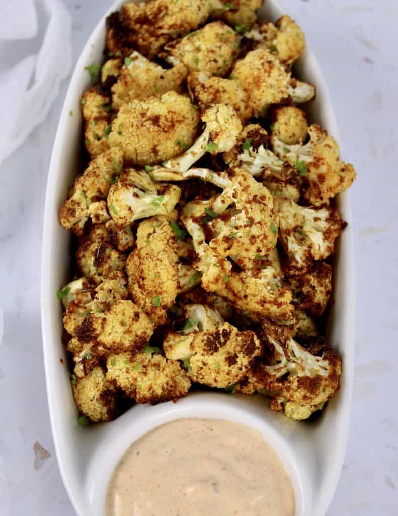 overhead view of Air Fryer Cauliflower with Dipping Sauce in white serving dish