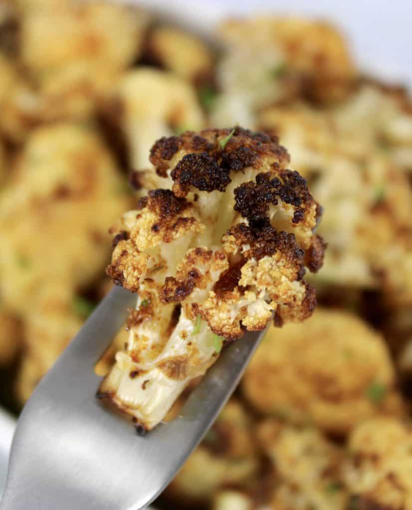 closeup of roasted cauliflower on fork