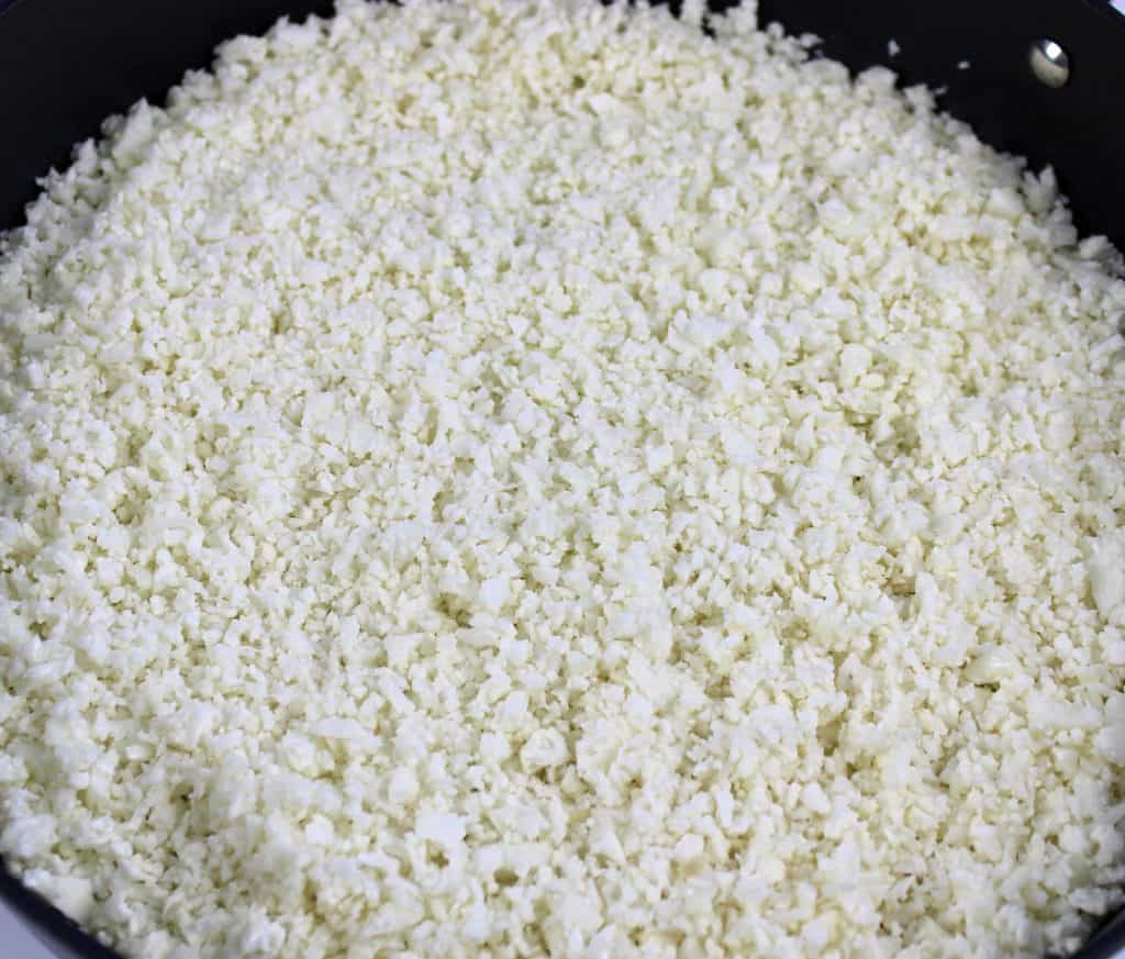 raw cauliflower rice in skillet