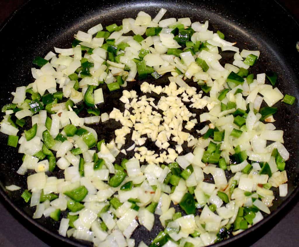 diced onions poblanos garlic in skillet