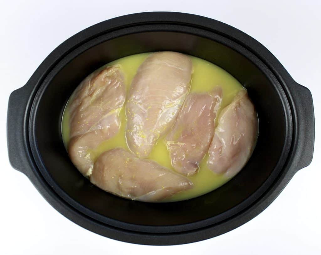 5 chicken breasts with chicken broth in slow cooker