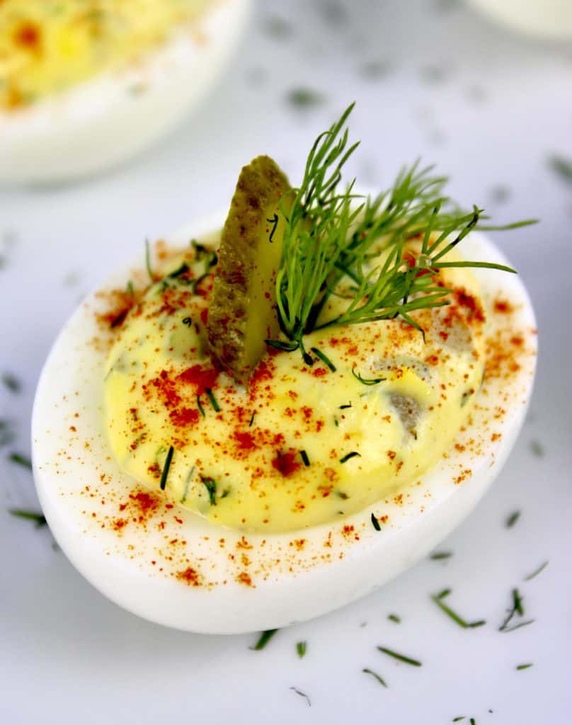 closeup of Dill Pickle Deviled Eggs with paprika on top