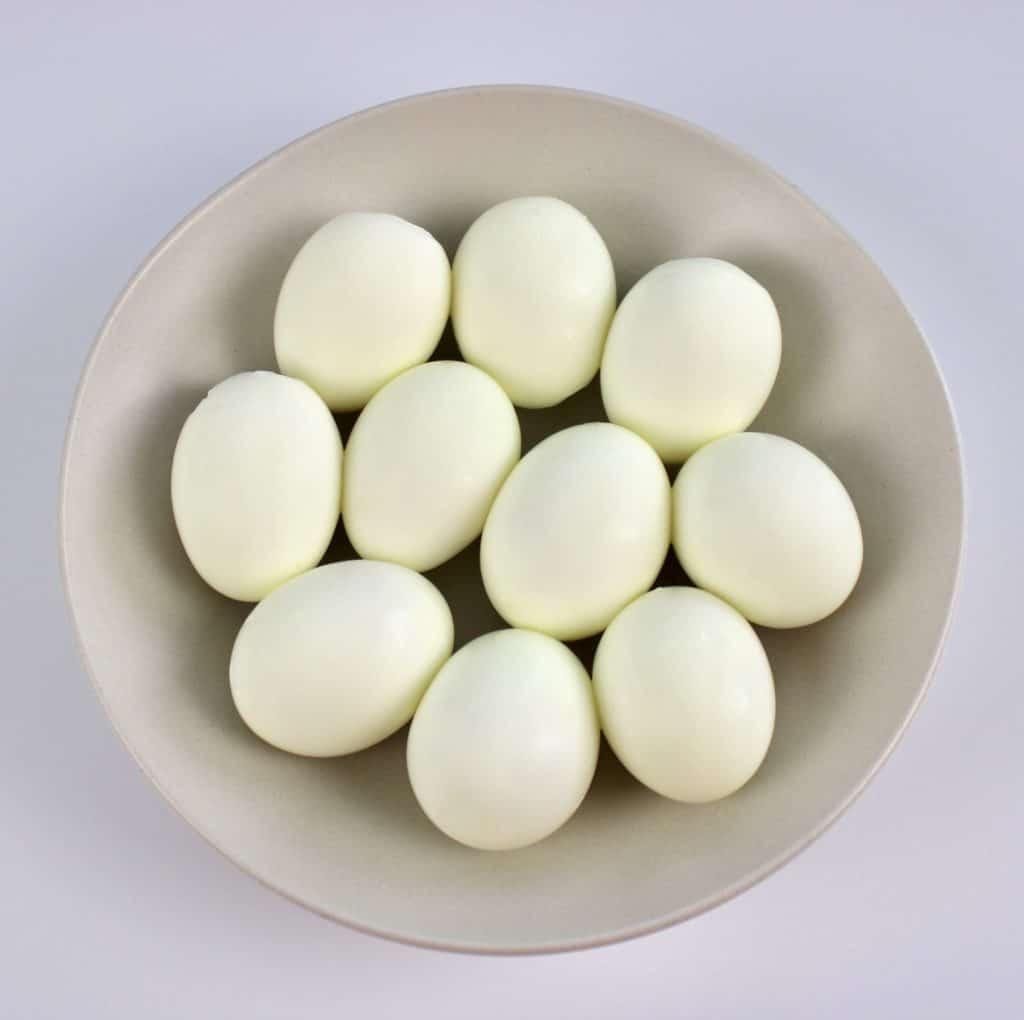 10 hard boiled eggs in beige bowl