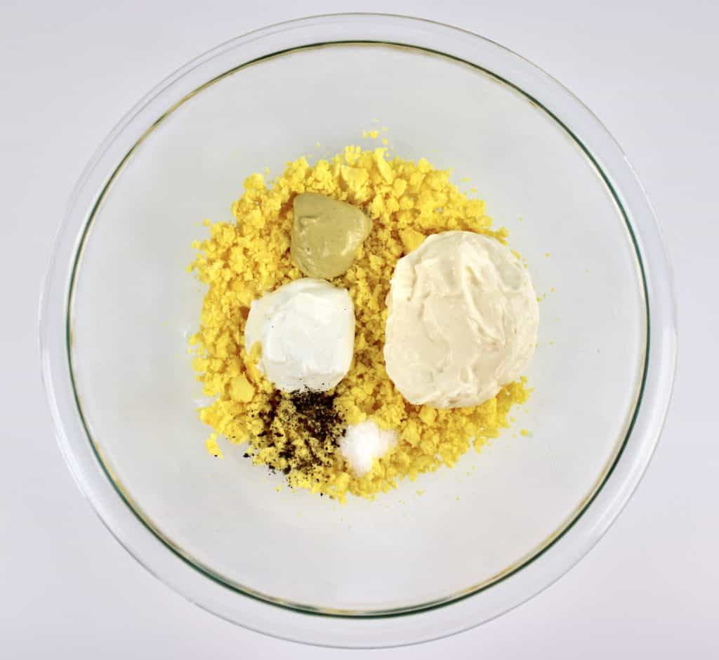 deviled eggs mixture in glass bowl unmixed