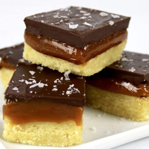 Caramel Slice stacked up on white plate