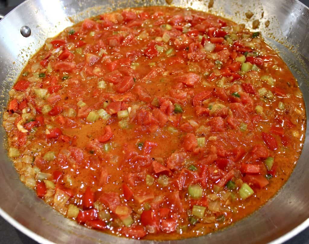 tomatoes peppers onions in skillet