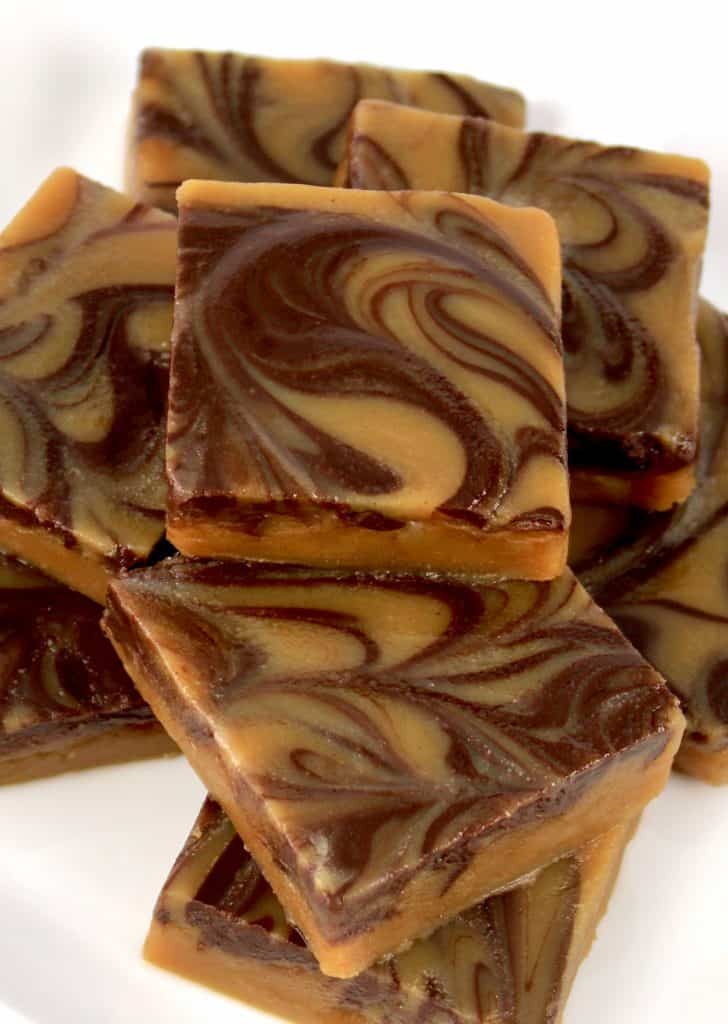 Keto Peanut Butter Chocolate Fudge squares stacked up