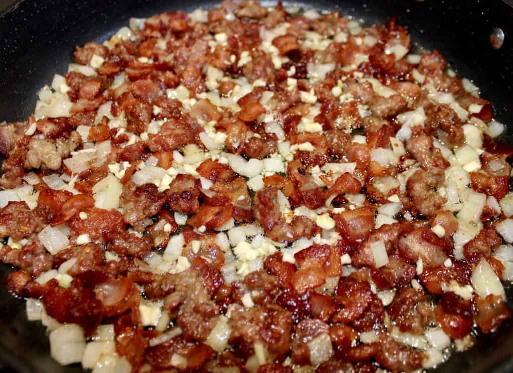 cooked sausage bacon onion garlic in skillet