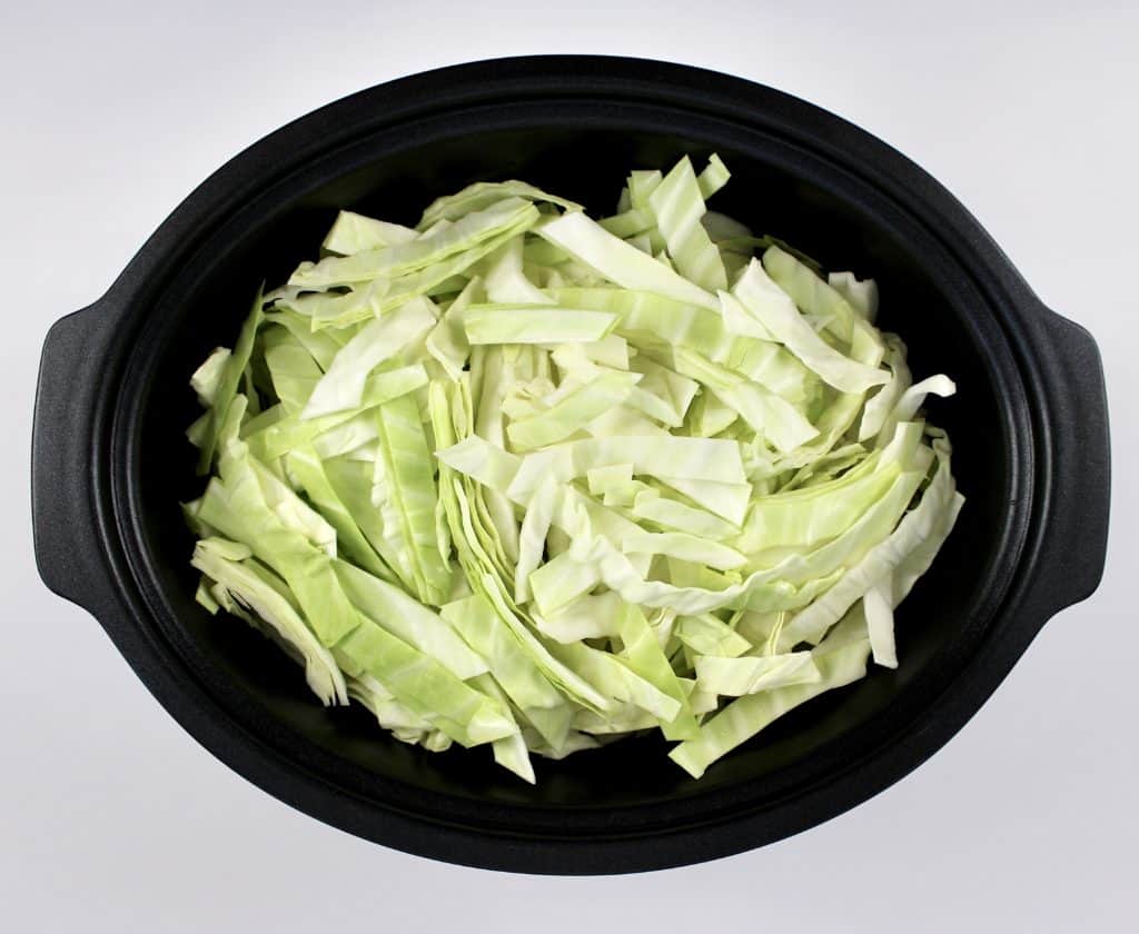 shredded raw cabbage in slow cooker