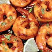 closeup of chili lime shrimp with lime wedge