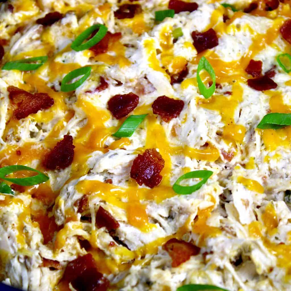 closeup of ranch chicken with cheese and bacon on top