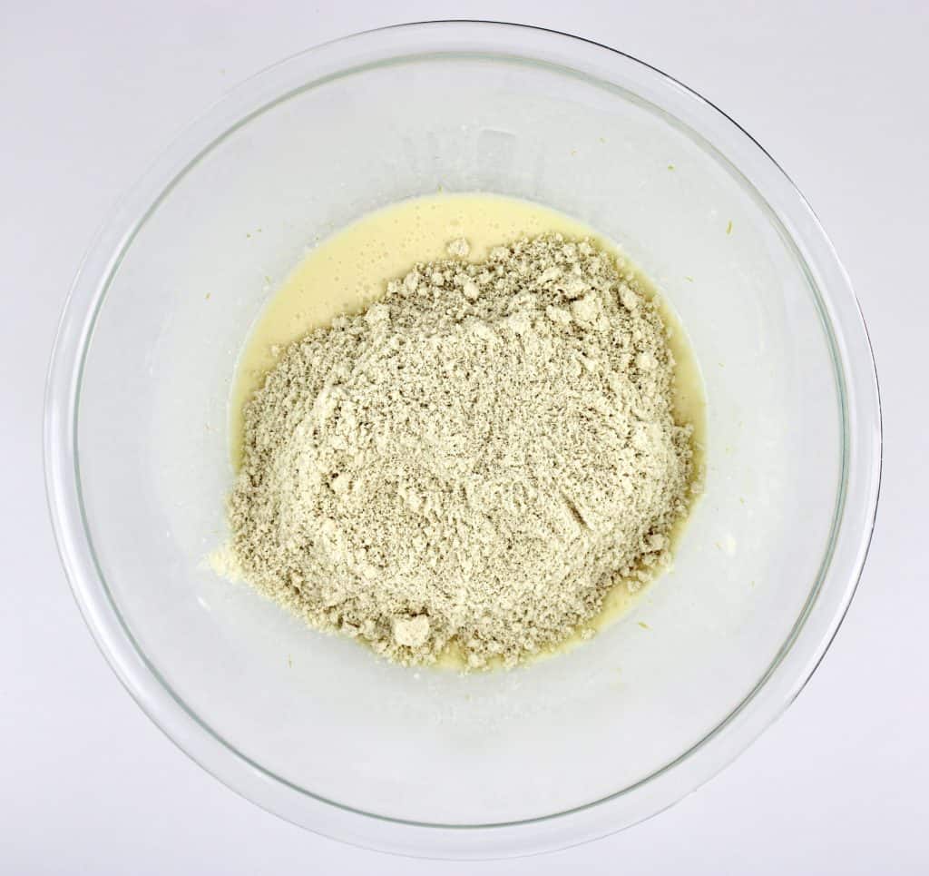 wet and dry ingredients unmixed in glass bowl