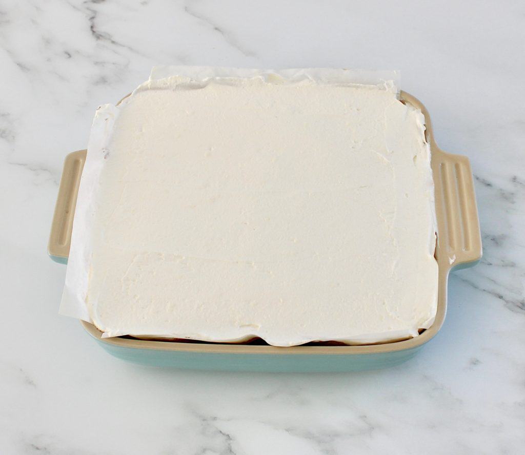 chocolate lasagna whip cream top layer in baking dish
