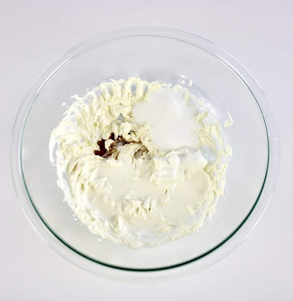 cheesecake mixture in glass bowl unmixed