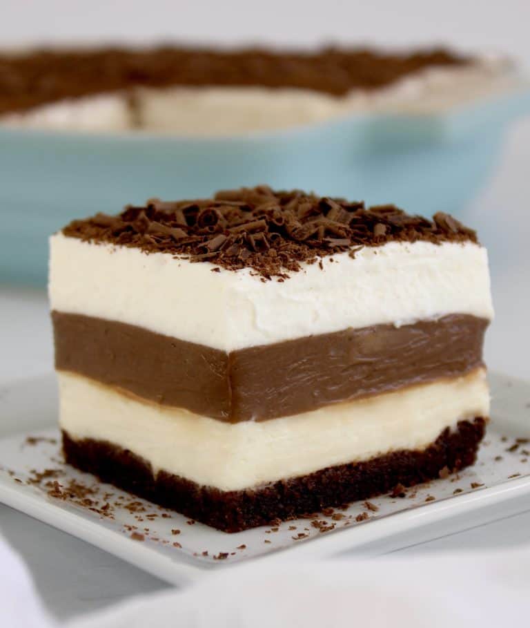 closeup of slice of chocolate lasagna with casserole in background