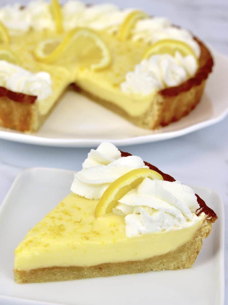 slice of Keto Lemon Mascarpone Tart with tart in background