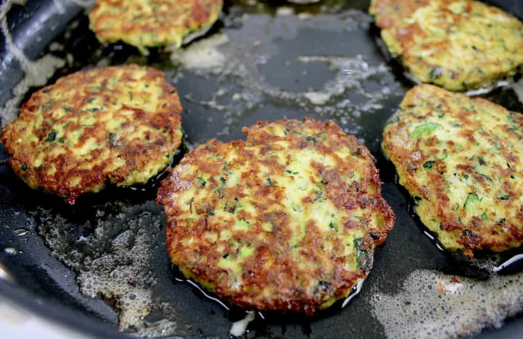 Keto Zucchini Fritters cooked in skillet