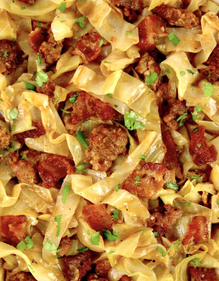 closeup of Slow Cooker Cabbage with sausage and bacon pieces