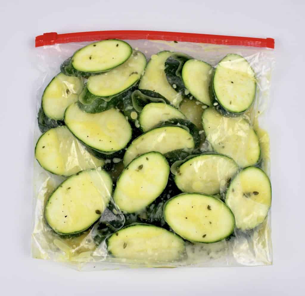 zucchini slices in bag with lemon dressing marinade