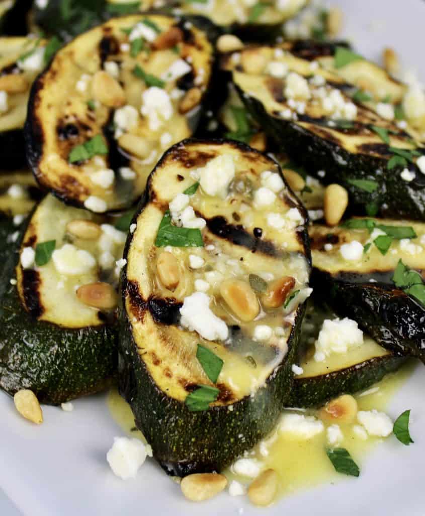 grilled zucchini slices with lemon slices feta and pine nuts
