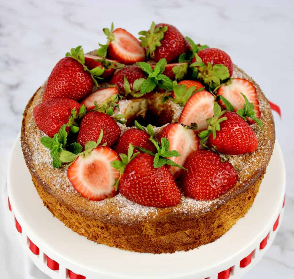 overhead view of angel food cake with strawberries on top