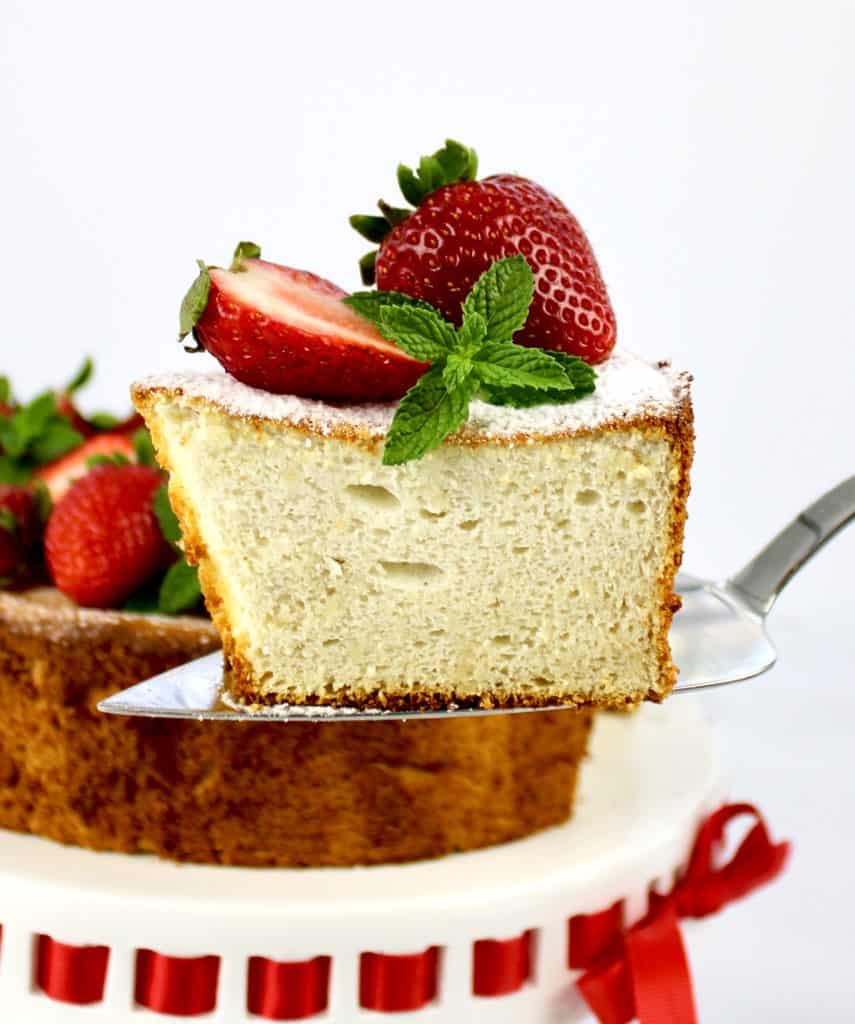 closeup of slice of angel food cake with strawberries on top