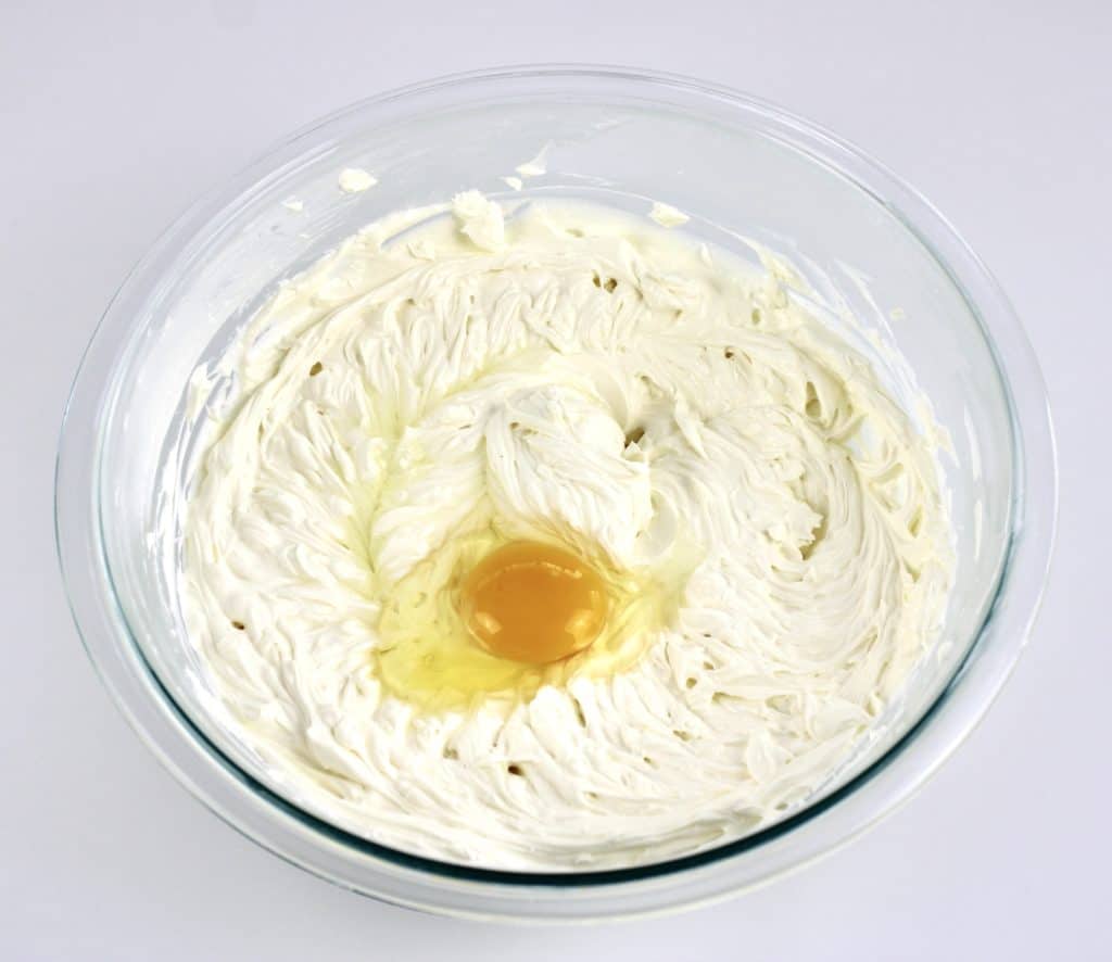 whipped cream cheese and egg in glass bowl