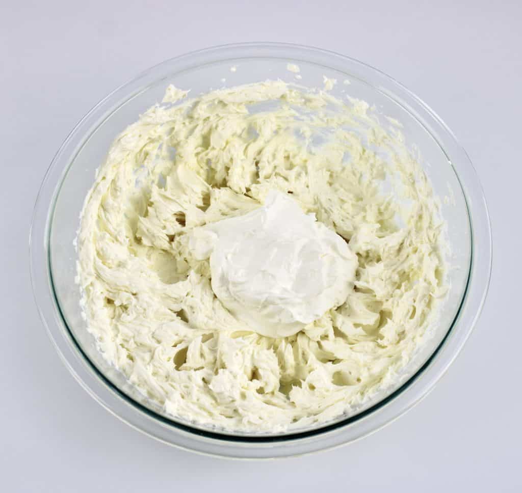 cream cheese and sour cream in mixing bowl