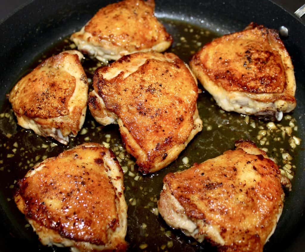 6 pieces of Honey Garlic Chicken cooking in skillet