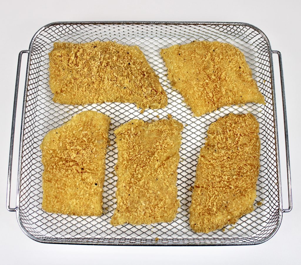 5 pieces of breaded fish in air fryer basket
